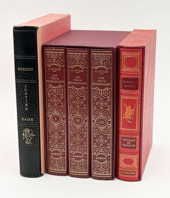 three books are stacked on top of each other on a white surface