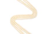 a single strand pearl necklace with a diamond clasp