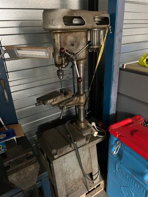 a machine that is sitting next to a blue box