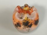 a glass vase with a picture of a dog inside of it