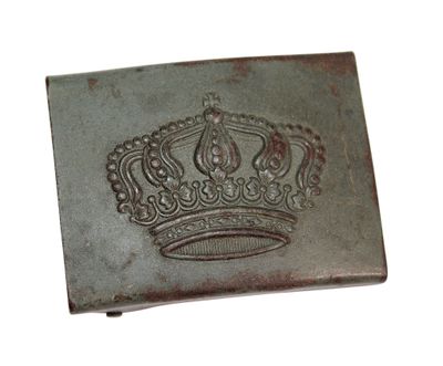 a metal belt buckle with a crown on it