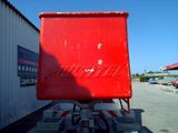 a large red box sitting on top of a trailer