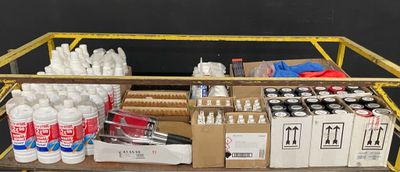 a cart full of supplies and supplies on a table