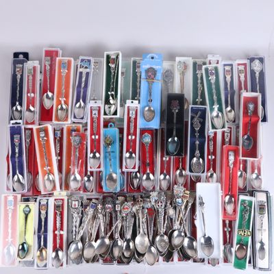 a lot of spoons and spoon knives in a box