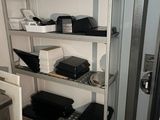 a metal shelving with many different items on it
