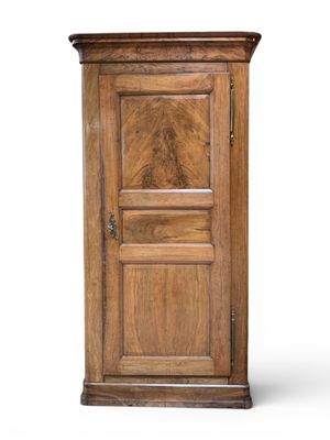an old wooden cabinet with a door on the top
