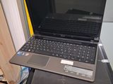 a laptop computer sitting on top of a suitcase