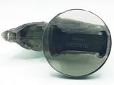 a close up of a metal object with a mirror on it