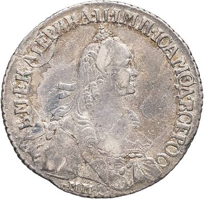 a silver coin with a portrait of a woman on it