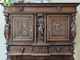 a wooden cabinet with carvings on the front of it