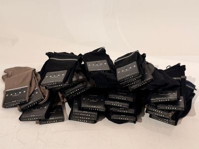 many pairs of socks that are stacked on top of each other
