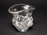 a clear glass vase with a design on it