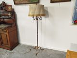 a lamp that is next to a piano in a room