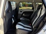a white truck with black seats and a black seat belt