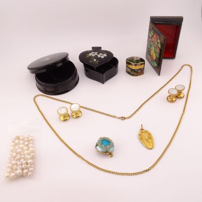 a lot of jewelry sitting on a white surface
