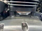 a close up of a motorcycle engine with a number plate on it