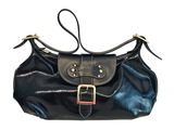 black leather handbag with metal buckles on a white background