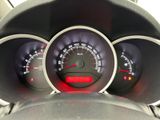a close up of a car dashboard with various gauges