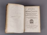an open book with a picture of a coat of arms on top of it