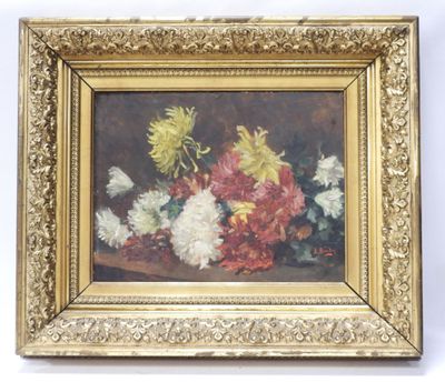 une image représentant un tableau de fleurs dans un cadre doré