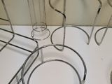 a white counter top with a bunch of metal items on it