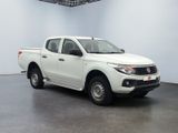a picture of a white pick up truck parked in a garage