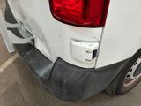 a close up of a white truck with a red light on it