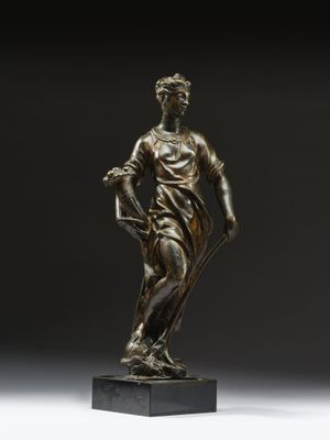une image représentant une statue en bronze d'une femme tenant un panier