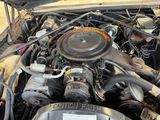 a picture of a car engine with its hood open