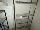 a metal shelving in the corner of a room