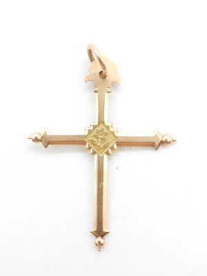 une image représentant une croix en or sur laquelle est posé un oiseau