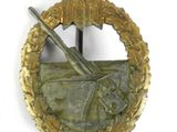 an image of a badge with a bird and a gun on it