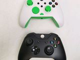 two controllers sitting next to each other on a table