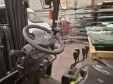 a close up of a forklift in a warehouse