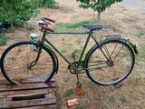 a bike that is parked next to a wooden pallet