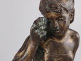 statue of a woman holding a cell phone to her ear