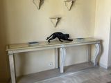 an image of a room with a table and a cat