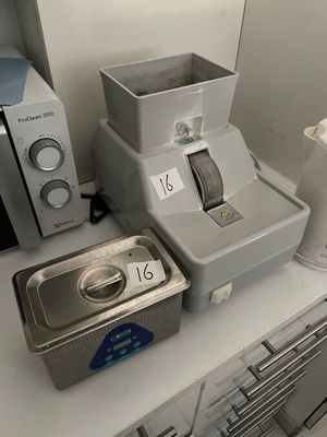 a blender and a microwave sitting on a counter in a kitchen