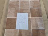 a cardboard box that has some tiles on it