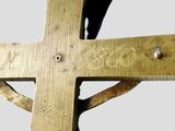 a wooden cross with a bird perched on top of it