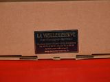 a box with a label on it sitting on a red surface