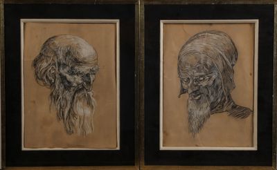 deux dessins encadrés représentant un homme et une femme à la longue barbe