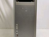 a close up of an apple mac pro computer on a white surface