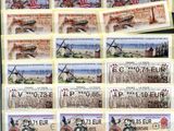 some of the stamps are of different countries on a table