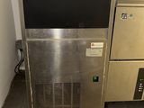 two machines that are next to each other in a room