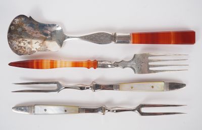 five different types of knives and forks on a white surface
