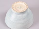 a blue vase with a white lid sitting on a table