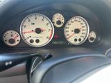 a close up of a car dashboard with various gauges and numbers