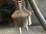 a close up of an electrical plug on the side of a bus