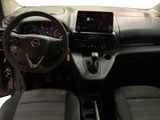 the interior of a small car with a steering wheel and dashboard